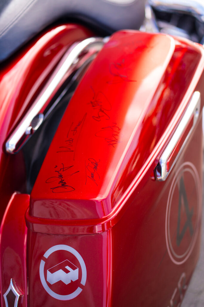 Shriners Children's motorcycle fender with Foreigner band signatures